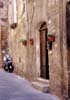 travel photo of doorway, scooter in Pitigliano, Tuscany Italy by Diane Rose Photographs